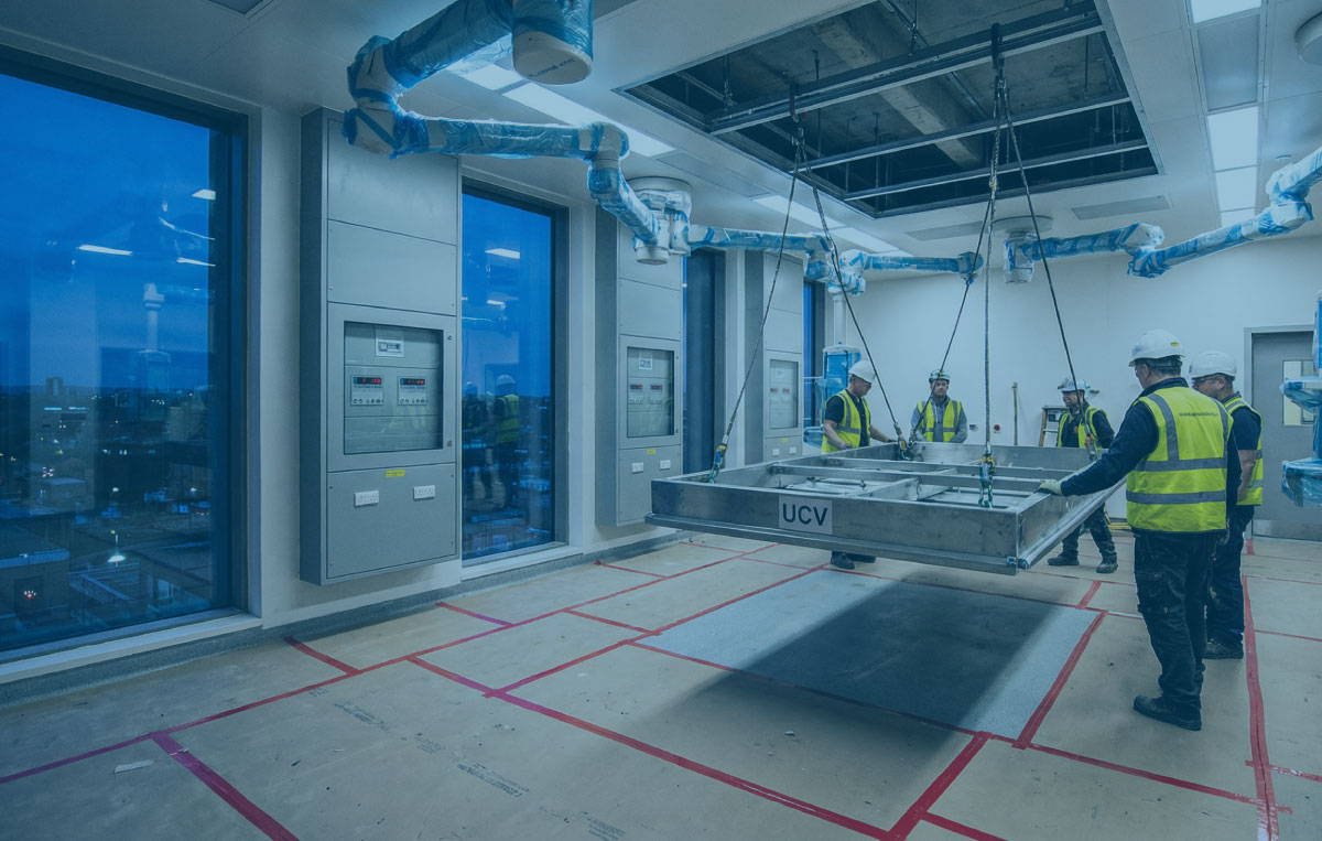 Operating theatre upgrade at blue hour with a UCV canopy install, IPS panels and clean floor protection